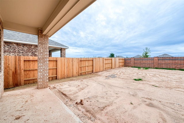 view of yard featuring a fenced backyard and a patio area