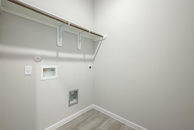laundry room featuring hookup for a gas dryer, baseboards, electric dryer hookup, laundry area, and washer hookup
