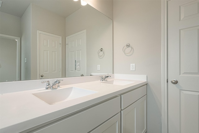 bathroom with double vanity and a sink