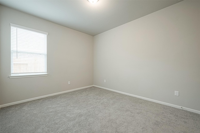 spare room featuring baseboards