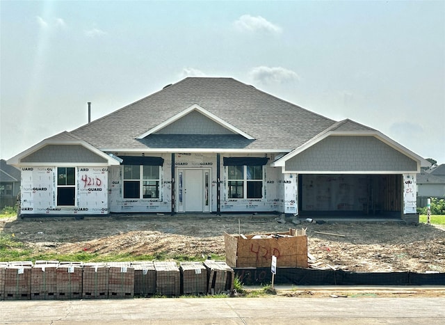 4210 Leslies Way, Dickinson, TX 77539 - unfinished property featuring an attached garage, roof with shingles, driveway, and covered porch