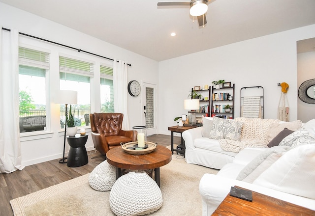 living area with baseboards, wood finished floors, ceiling fan, and recessed lighting