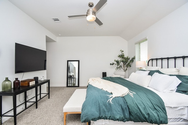 bedroom featuring lofted ceiling, baseboards, carpet floors, ceiling fan, and visible vents