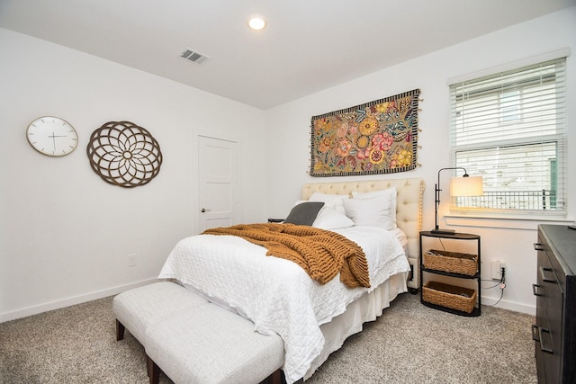 carpeted bedroom featuring baseboards, visible vents, and recessed lighting