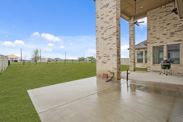 view of patio / terrace with a fenced backyard, area for grilling, and ceiling fan