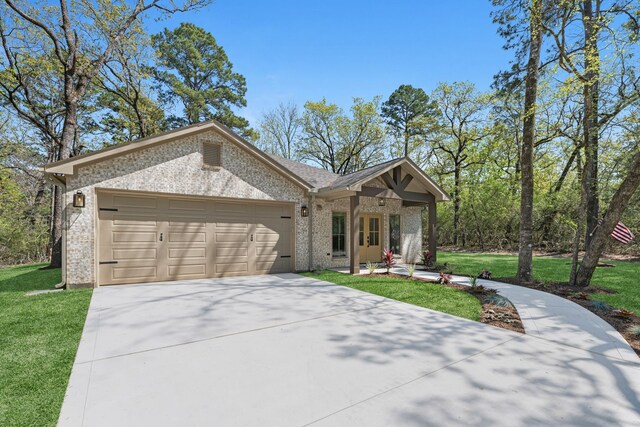 20302 Peach Dr, Huntsville, TX 77320 - ranch-style house with brick siding, a garage, driveway, and a front lawn