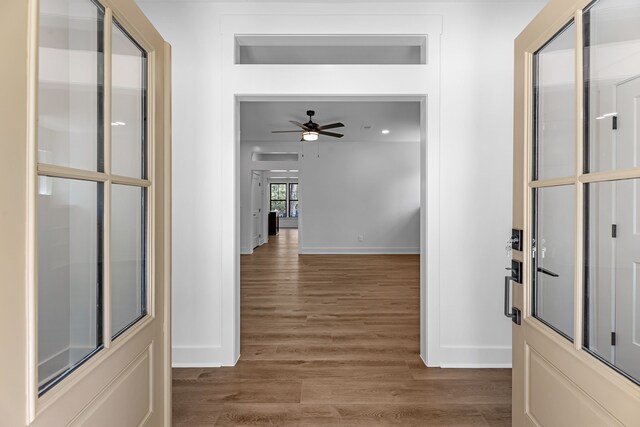 20302 Peach Dr, Huntsville, TX 77320 - hall with baseboards and wood finished floors