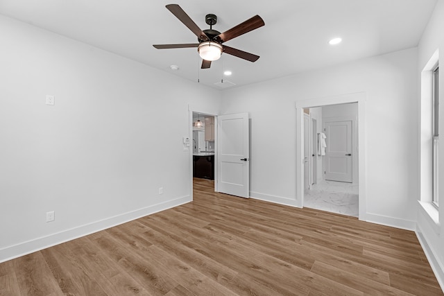 20302 Peach Dr, Huntsville, TX 77320 - unfurnished bedroom featuring connected bathroom, light wood-style flooring, recessed lighting, baseboards, and a ceiling fan