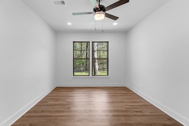 20302 Peach Dr, Huntsville, TX 77320 - unfurnished room featuring a ceiling fan, wood finished floors, recessed lighting, and baseboards