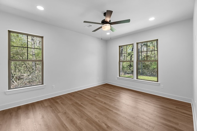 20302 Peach Dr, Huntsville, TX 77320 - empty room with wood finished floors, recessed lighting, baseboards, and ceiling fan