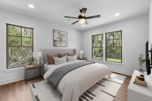 20302 Peach Dr, Huntsville, TX 77320 - bedroom with baseboards, recessed lighting, wood finished floors, and a ceiling fan