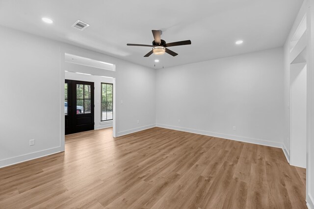 20302 Peach Dr, Huntsville, TX 77320 - empty room with light wood-type flooring, ceiling fan, recessed lighting, and baseboards