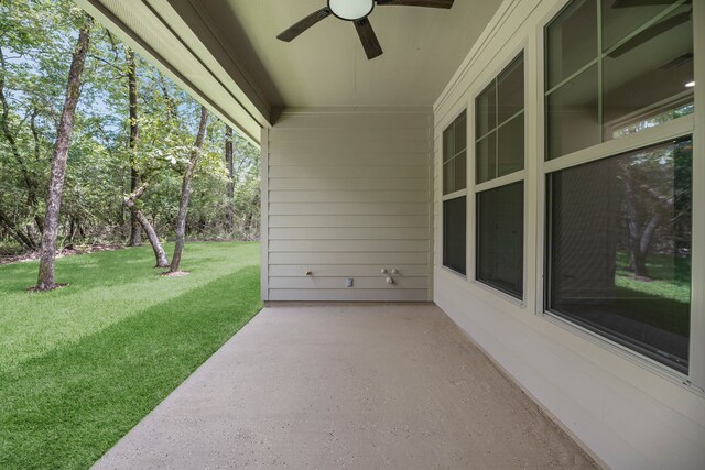 20302 Peach Dr, Huntsville, TX 77320 - view of patio / terrace featuring a ceiling fan and view of wooded area