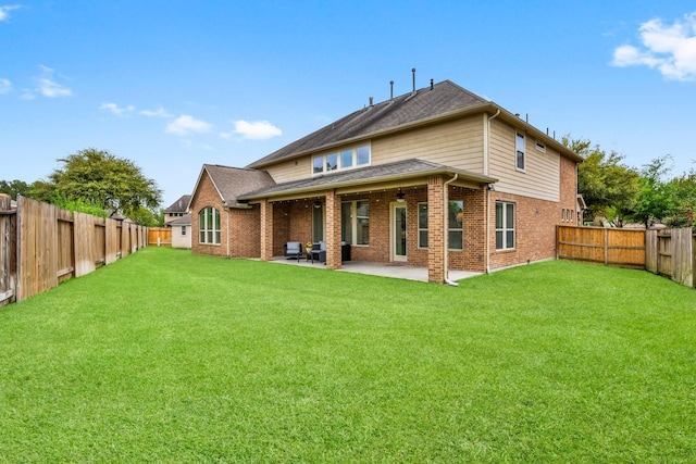 24606 Bennetts Ridge Ln, Porter, TX 77365 - rear view of property featuring brick siding, a patio area, and a shingled roof