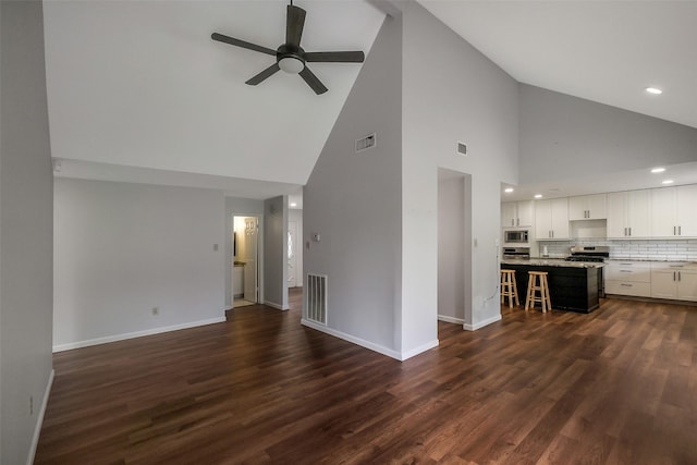 902 Rolling Mill Dr, Sugar Land, TX 77498 - unfurnished living room featuring high vaulted ceiling, baseboards, a ceiling fan, and visible vents