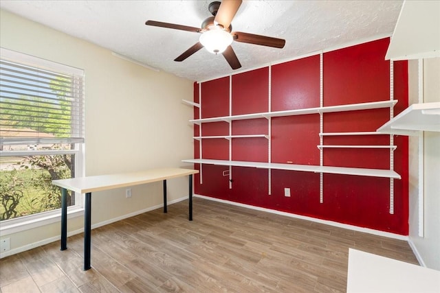 13623 Wimbledon Oaks Dr, Houston, TX 77065 - unfurnished office featuring wood finished floors, a ceiling fan, healthy amount of natural light, a textured ceiling, and baseboards