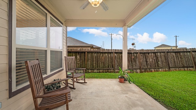 view of patio / terrace featuring a fenced backyard and a ceiling fan