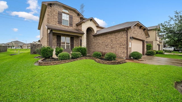 view of front of property with concrete driveway, brick siding, an attached garage, and a front lawn