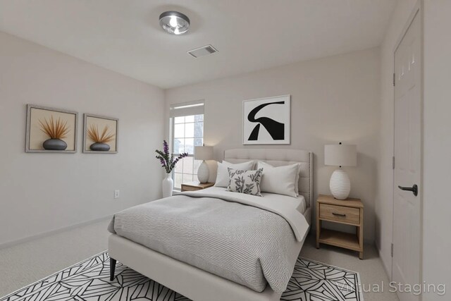 bedroom with light colored carpet, baseboards, and visible vents