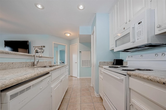 9520 Seawall Blvd Unit 126, Galveston, TX 77554 - kitchen with white appliances, white cabinetry, a sink, and light tile patterned floors