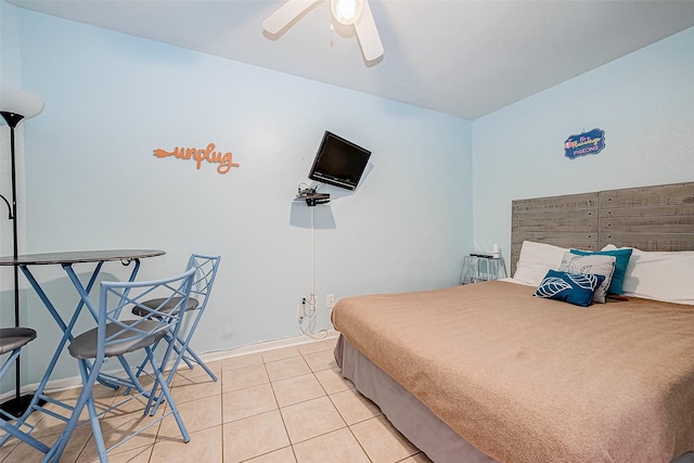 9520 Seawall Blvd Unit 126, Galveston, TX 77554 - bedroom with light tile patterned floors and ceiling fan