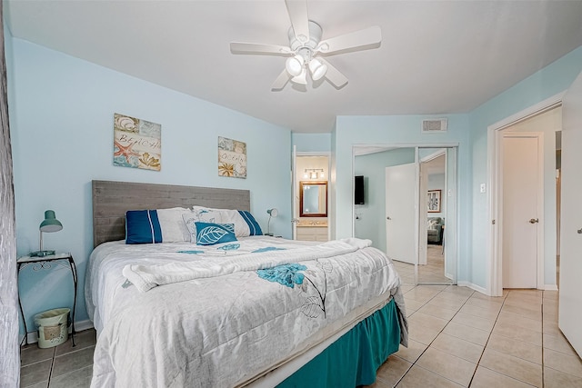 9520 Seawall Blvd Unit 126, Galveston, TX 77554 - bedroom with visible vents, baseboards, a ceiling fan, connected bathroom, and light tile patterned flooring
