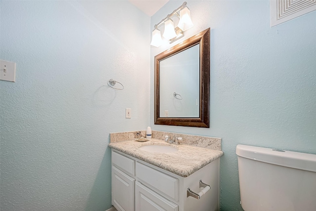 9520 Seawall Blvd Unit 126, Galveston, TX 77554 - half bath with toilet, vanity, and visible vents