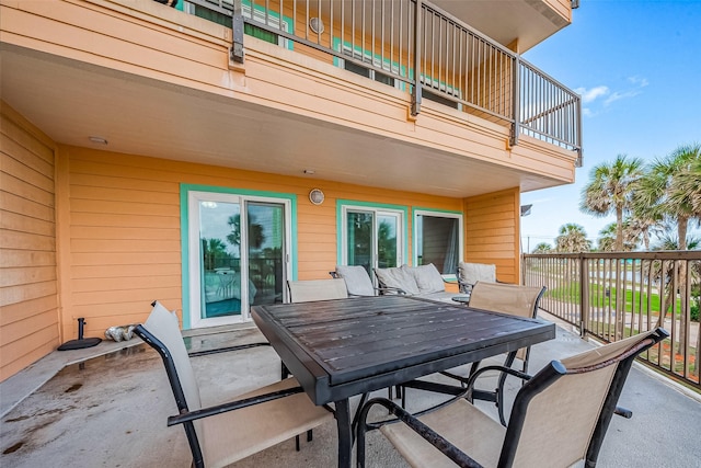 9520 Seawall Blvd Unit 126, Galveston, TX 77554 - view of patio / terrace with outdoor dining area and a balcony
