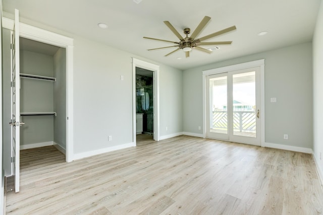 18821 Warrior Rd, Galveston, TX 77554 - unfurnished bedroom featuring a spacious closet, access to outside, baseboards, and recessed lighting