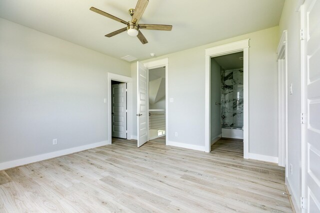 18821 Warrior Rd, Galveston, TX 77554 - unfurnished bedroom with light wood-type flooring, baseboards, connected bathroom, and ceiling fan