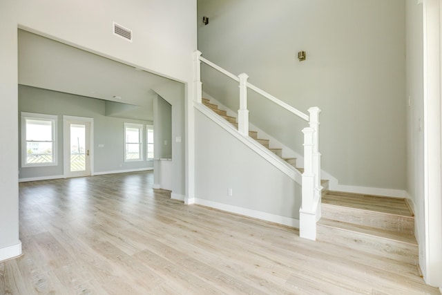 18821 Warrior Rd, Galveston, TX 77554 - stairs with wood finished floors and baseboards