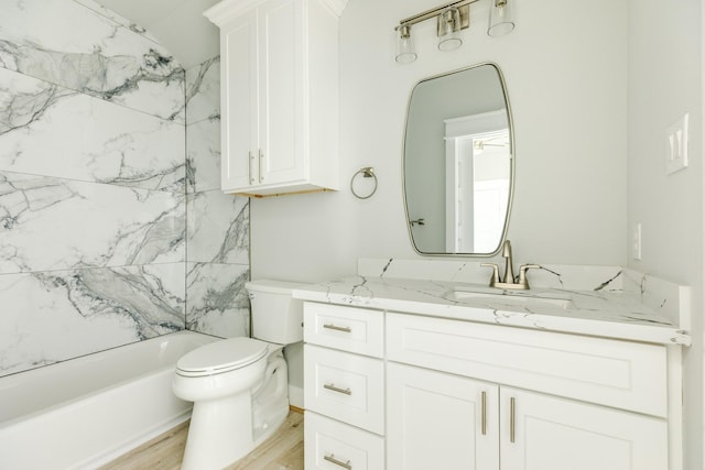 18821 Warrior Rd, Galveston, TX 77554 - full bath featuring vanity, toilet, bathtub / shower combination, and wood finished floors