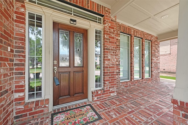 3730 Arundel Gardens Ln, Sugar Land, TX 77498 - doorway to property featuring a porch and brick siding