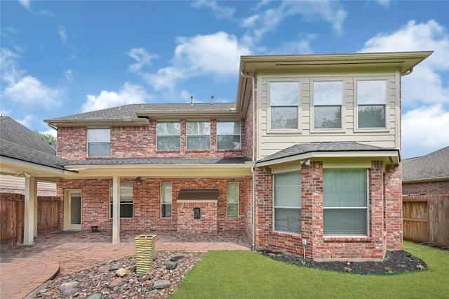 3730 Arundel Gardens Ln, Sugar Land, TX 77498 - rear view of house featuring a patio area, brick siding, and a shingled roof