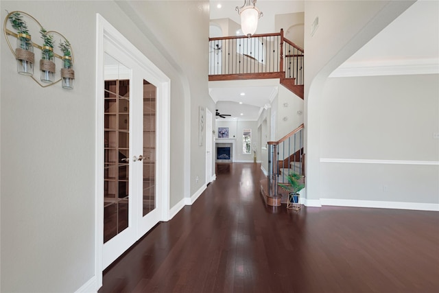 3730 Arundel Gardens Ln, Sugar Land, TX 77498 - foyer entrance featuring stairs, wood finished floors, french doors, a high ceiling, and ornamental molding