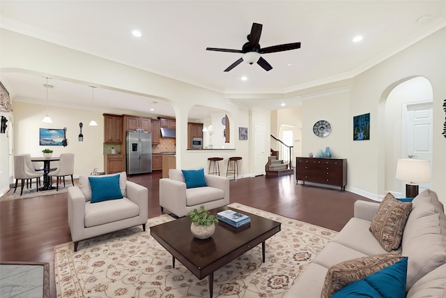 3730 Arundel Gardens Ln, Sugar Land, TX 77498 - living area featuring arched walkways, wood finished floors, a ceiling fan, recessed lighting, and baseboards