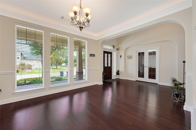 3730 Arundel Gardens Ln, Sugar Land, TX 77498 - entryway featuring arched walkways, a chandelier, french doors, wood finished floors, and ornamental molding