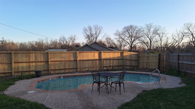 view of swimming pool with a fenced backyard and a fenced in pool