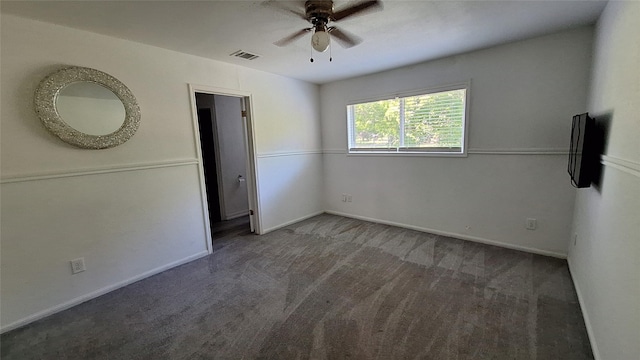 unfurnished bedroom featuring carpet flooring, a ceiling fan, visible vents, and baseboards
