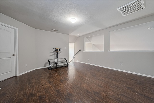 5407 Matilda Bend Ln, Katy, TX 77449 - spare room with a textured ceiling, baseboards, visible vents, and wood finished floors