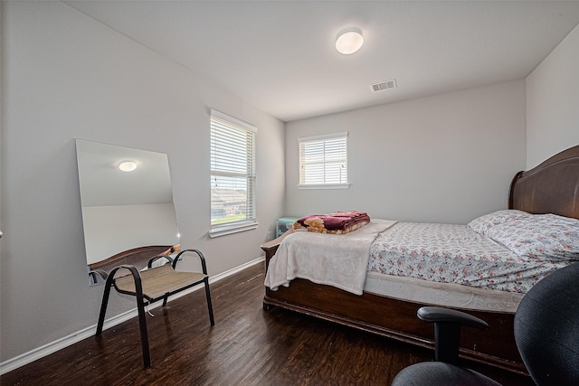 5407 Matilda Bend Ln, Katy, TX 77449 - bedroom featuring baseboards, visible vents, and wood finished floors