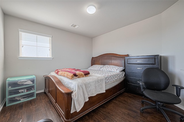 5407 Matilda Bend Ln, Katy, TX 77449 - bedroom featuring baseboards, visible vents, and wood finished floors