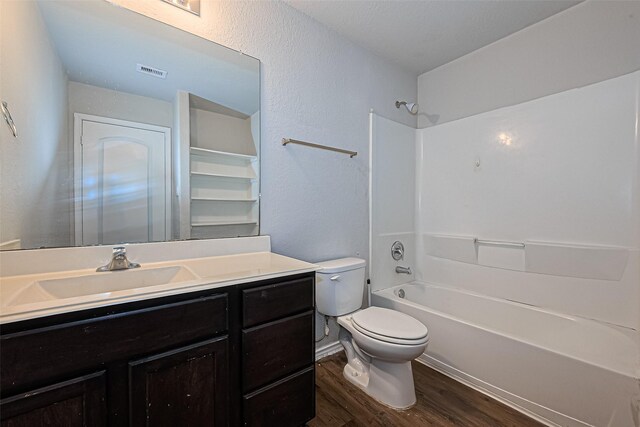 5407 Matilda Bend Ln, Katy, TX 77449 - full bath featuring toilet, wood finished floors, bathing tub / shower combination, visible vents, and vanity