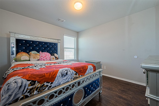 5407 Matilda Bend Ln, Katy, TX 77449 - bedroom featuring baseboards, visible vents, and dark wood finished floors