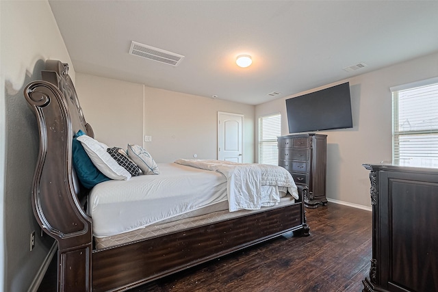 5407 Matilda Bend Ln, Katy, TX 77449 - bedroom featuring baseboards, visible vents, and dark wood finished floors