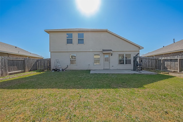 5407 Matilda Bend Ln, Katy, TX 77449 - rear view of house featuring a fenced backyard, a patio, and a lawn