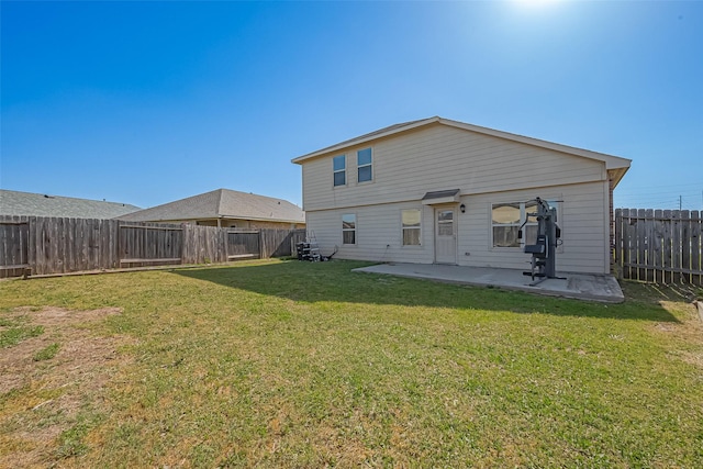 5407 Matilda Bend Ln, Katy, TX 77449 - back of house featuring a patio area, a lawn, and a fenced backyard