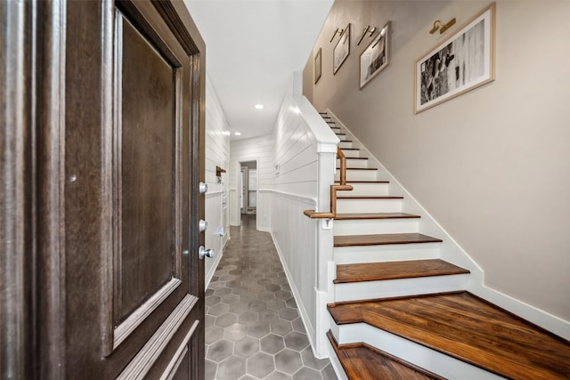 staircase with recessed lighting and tile patterned floors