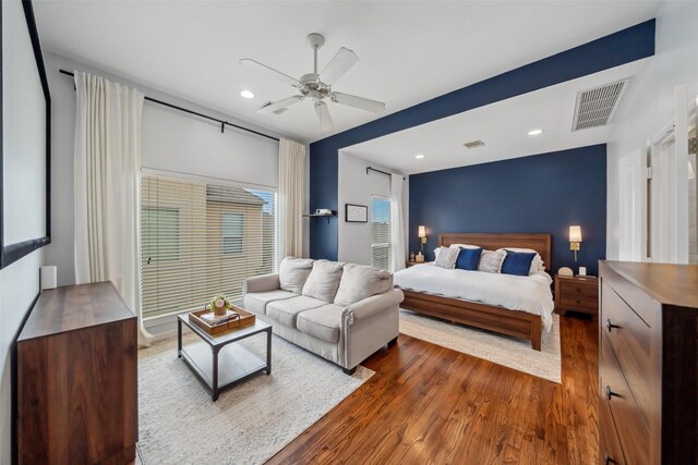 bedroom with a ceiling fan, dark wood-type flooring, visible vents, and recessed lighting