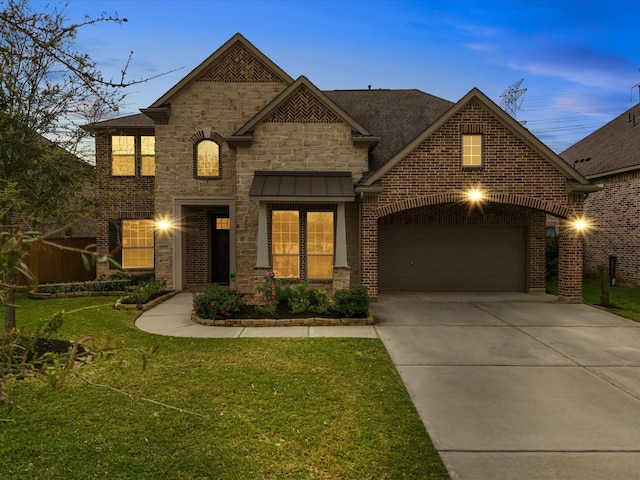 2712 Ahnya Ln, League City, TX 77573 - french provincial home with concrete driveway, stone siding, a front yard, a garage, and a shingled roof